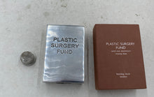 Load image into Gallery viewer, PLASTIC SURGERY FUND Bombay Duck London Sand Cast Aluminum Money Box
